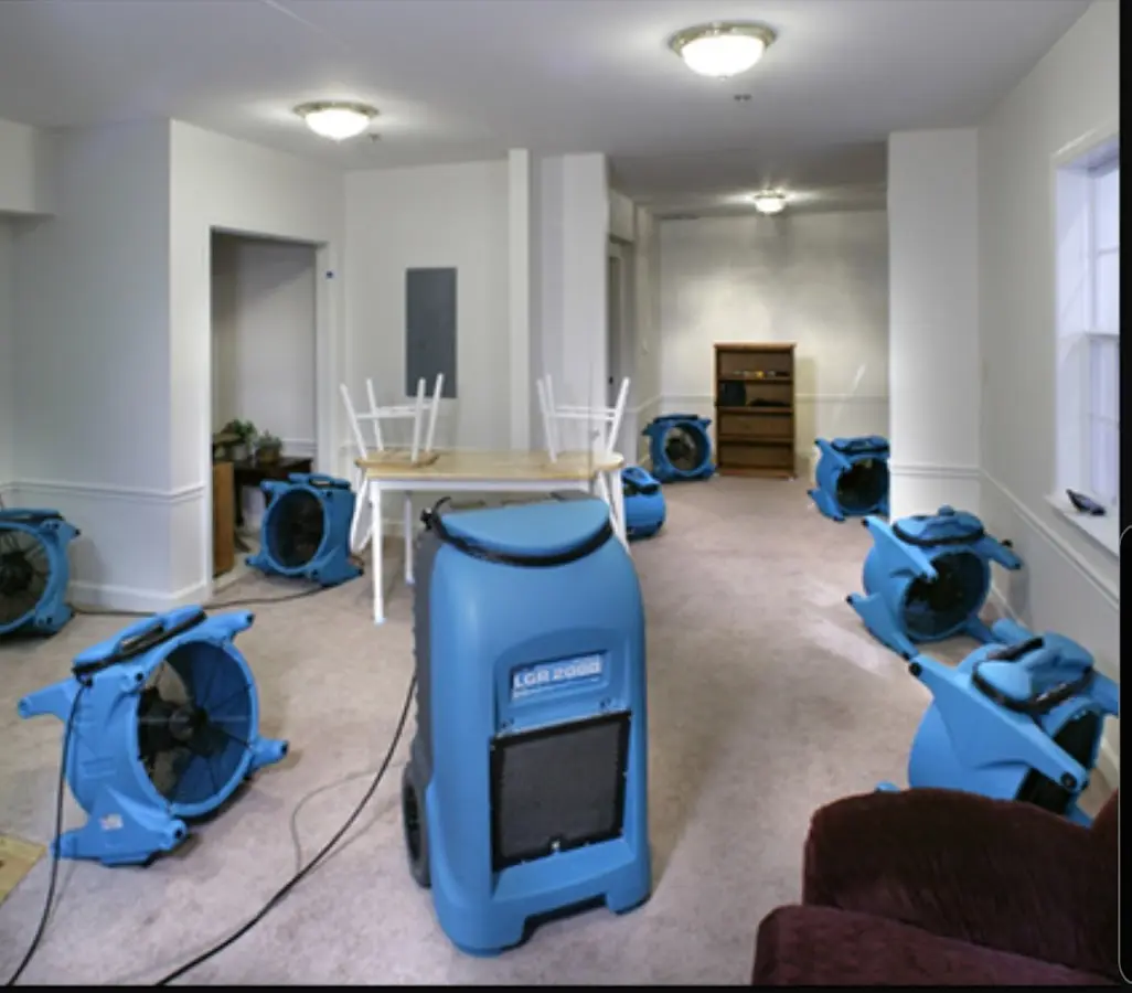 Air movers and dehumidifier setup for Water Damage Restoration in Bethel